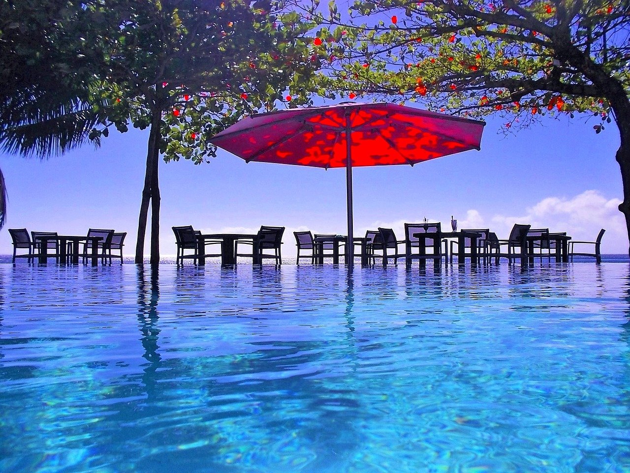 Baha-Shelf-image-with-chairs-and-umbrella